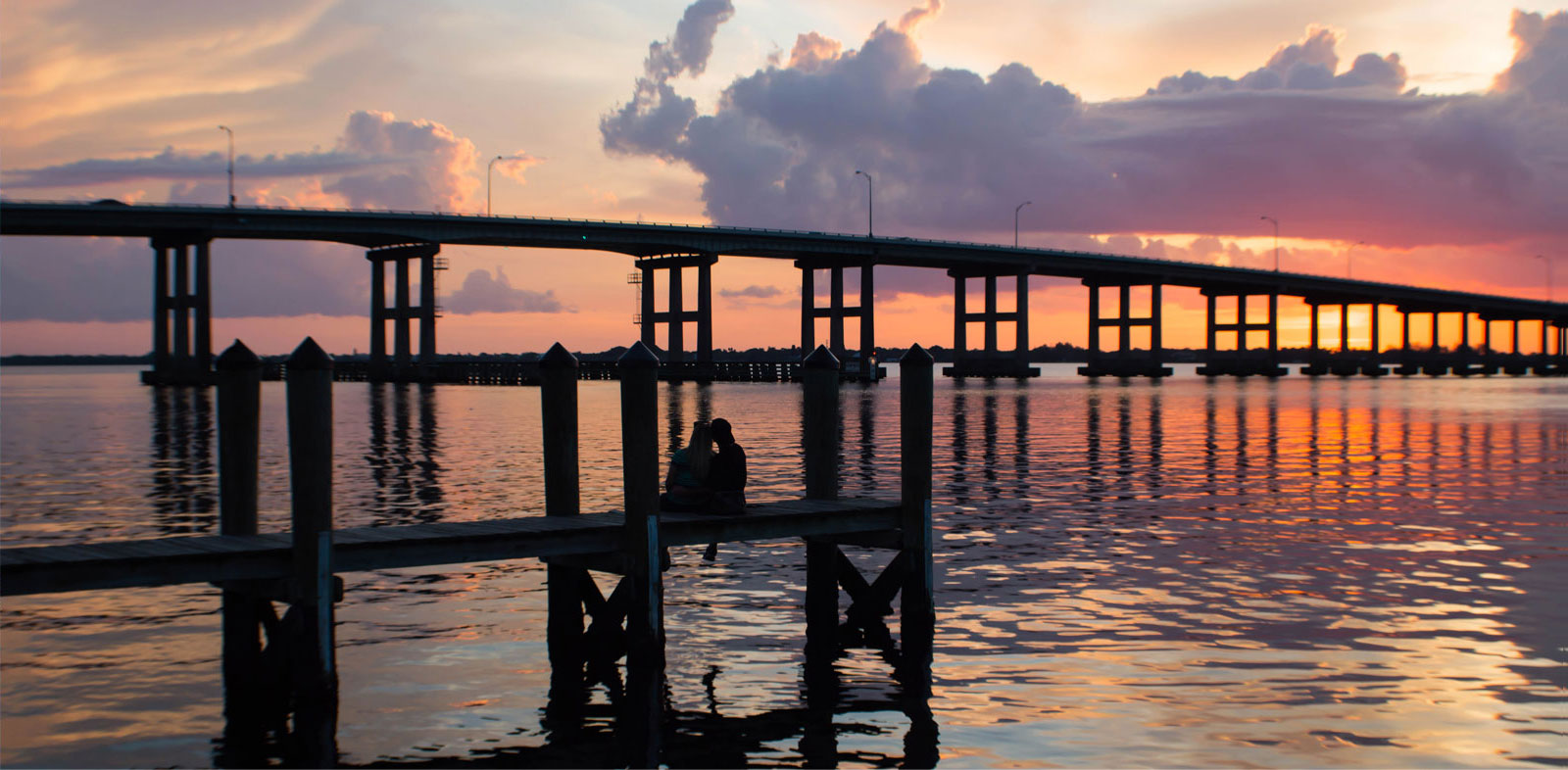 Bridge above the water on a sunset view