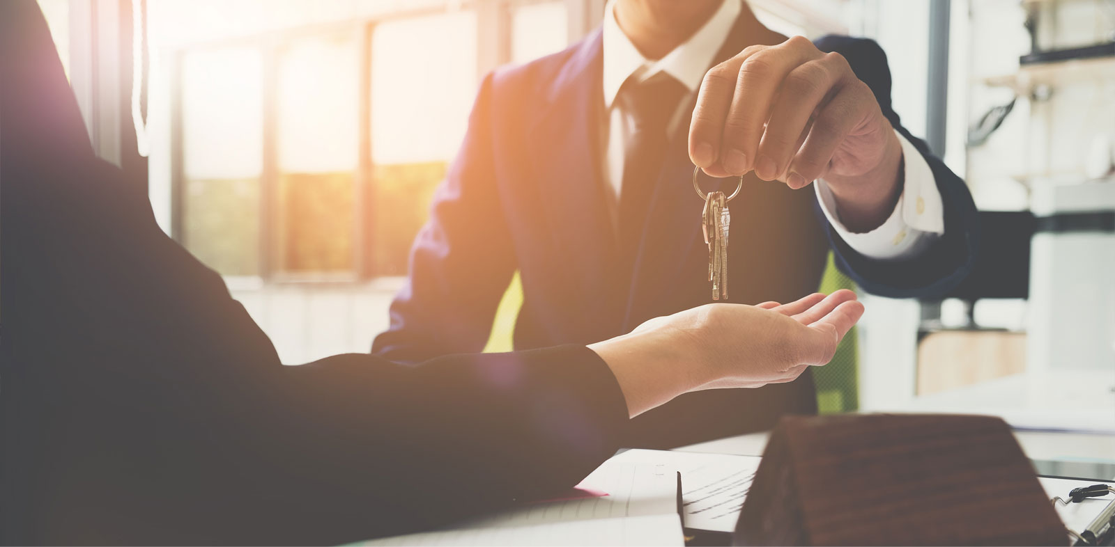 Turn over of house key from an agent to client